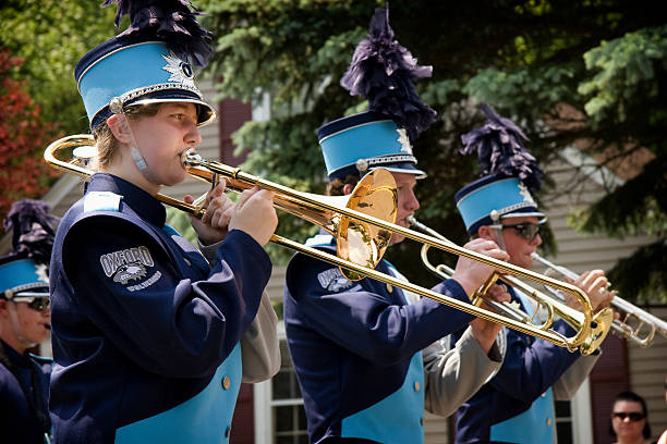 Salvador, Bahia, Brazil - July 02, 2025: Public school students are seen playing a musical instrument during a Bahia independence civic parade in Pelourinho, Salvador, Brazil.