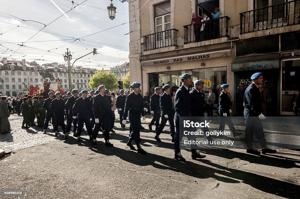 Religious Procession Every May in Lisbon "Lisbon, Portugal - May 6, 2012: People at the sidewalk and balcony watch the military parade precedes the religious procession in Baixa, Lisbon." Back Lit Stock Photo