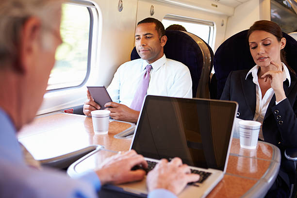 istock Businessman using his laptop on the train 458985131