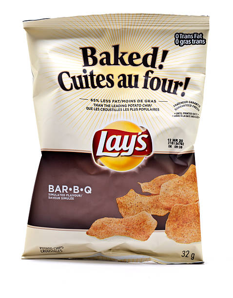 Lay's Potato Chips "Vancouver, Canada - February, 11 2012: A bag of Lays Baked potato chips against white background." lays potato chips stock pictures, royalty-free photos & images