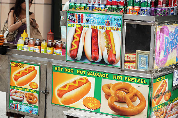 Hot dog and pretzel vendor street stall in NYC stock photo