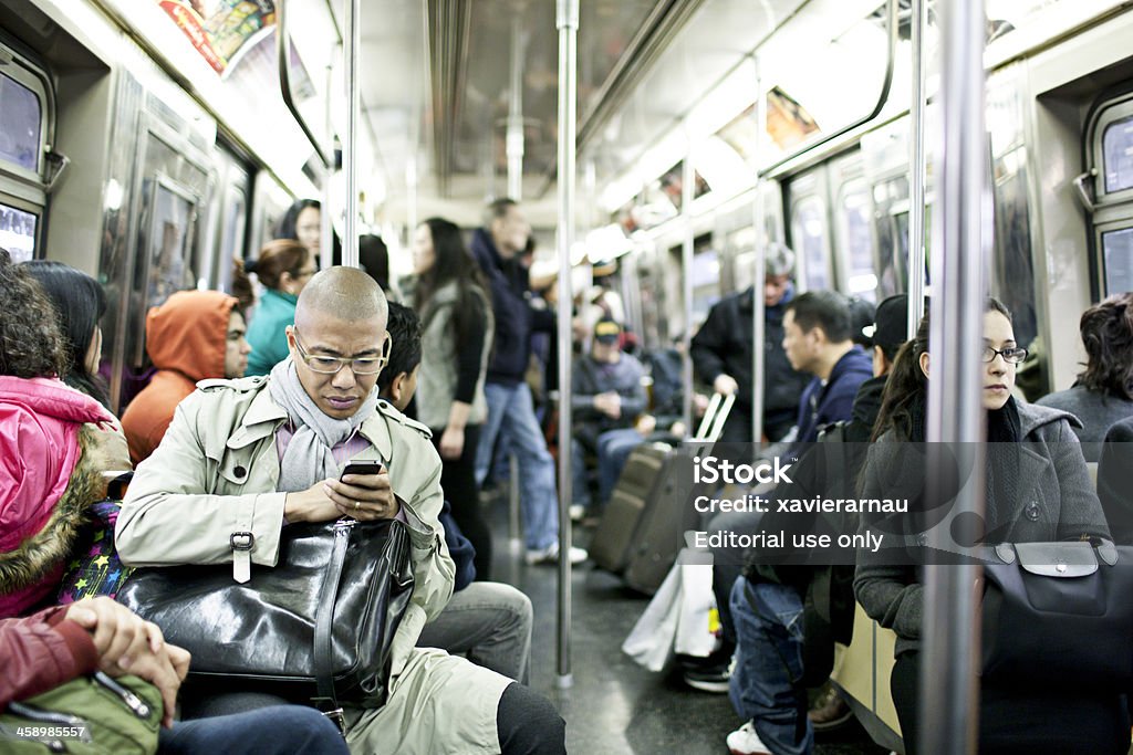 New York Subway Train New York, USA - March 15, 2012: People traveling  in a busy subway train in New York city. New York City Subway Stock Photo