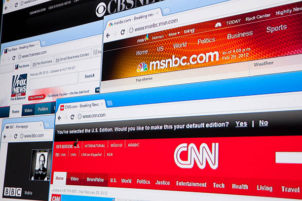 News Websites "Nashville, Tennessee, USA - March, 1st 2012: A close up photograph of an array of the front page of several news websites, including CNN, MSNBC, BBC, Fox News, and CBS News, viewed on a computer monitor in Google's Chrome browser." bbc photos stock pictures, royalty-free photos & images