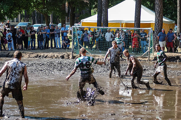 глиняная футбол - mudball стоковые фото и изображения