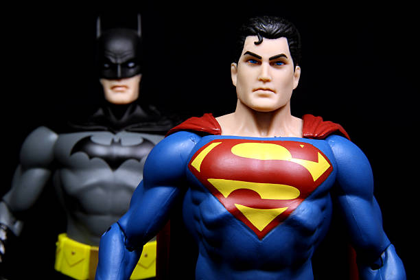 Superman in the Lead "Vancouver, Canada - October 9, 2012: Action figure models of Superman and Batman, released by DC comics, against a black background." superman named work stock pictures, royalty-free photos & images