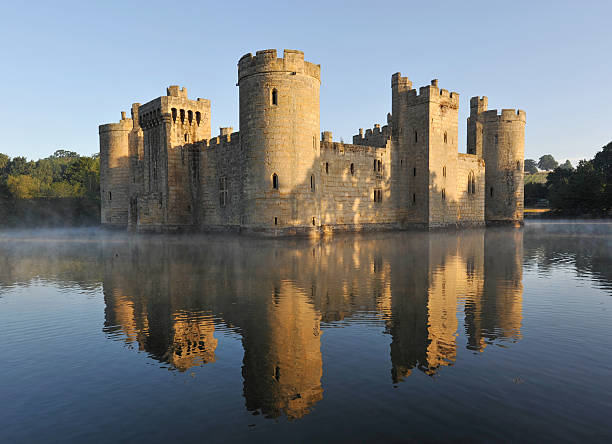 Castle "Bodiam,UK-July, 10th 2010: Bodiam Castle and moat in Kent reflected in the dawn light" circa 14th century photos stock pictures, royalty-free photos & images