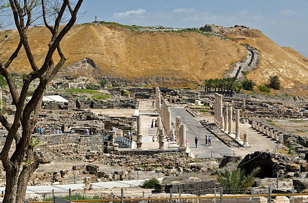 Beit Shean National Park "Beit Shean National Park, Israel - April 16, 2012: Beit Shean is one of the oldest settled sites in Israel. In biblical times the bodies of Saul and his sons were nailed to the city walls by the Philistines. In Roman times the city was known as Scythopolis Decapolis. Tourists stroll through the streets of this excavated settlement and explore the history. Beit Shean is an Israeli National Park." beit she'an stock pictures, royalty-free photos & images