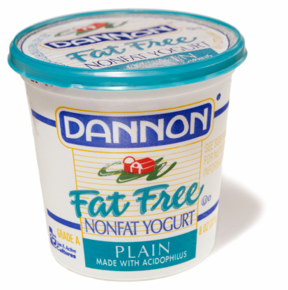 Truro, MA , United States - March 21, 2012: Dannon fat-free nonfat plain yogurt isolated on white background. Groupe Danone is a french food-products multinational corporation based in Paris. It claims world leadership in fresh dairy products, marketed under the corporate name, and also in bottled water. The Danone brand is marketed as Dannon, a subsidiary of Groupe Danone (under the name The Dannon Company) in the USA.