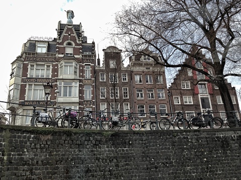Amsterdam, The Netherlands - March 23, 2013: Amsterdam architecture shot from a canal boat in the city. 