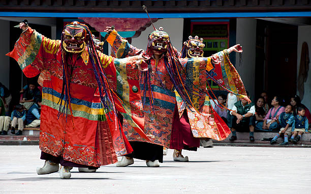 Tibetan Buddhist Monks with Masks during Festival Sikkim stock photo