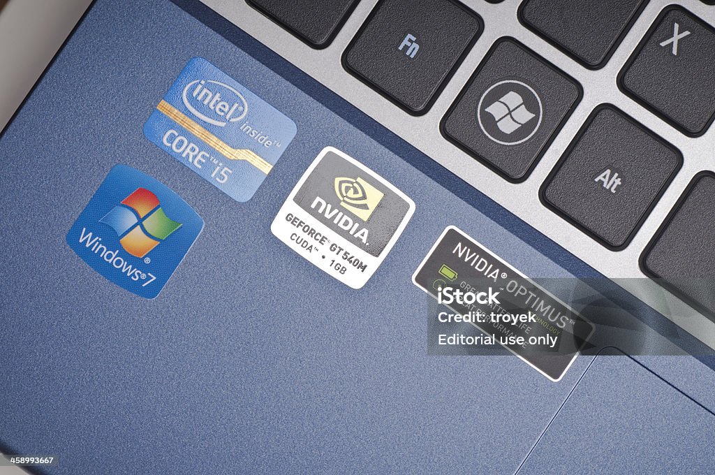 Windows, Intel and nvidia sticker on laptop computer "Gliwice, Poland - October 04, 2011: Stickers on a new laptop computer brag about its equipment: the Windows 7 operating system, the Intel Core i5 processor chip and nvidia graphic processor." Windows 7 Stock Photo