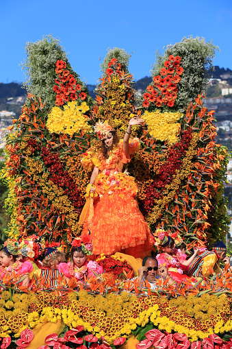 Funchal, Portugal - April 22, 2012: Madeira Flower Festival  Festa da Flor is a annual festival and parade in the city of Funchal. People dress with flowers are dancing on the street.