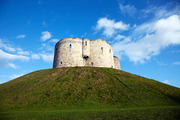 York Castle, Clifford's Tower "York, UK - December 13, 2011: The keep of York Castle, commonly known as Clifford's Tower, built in the 13th century." bailey castle photos stock pictures, royalty-free photos & images