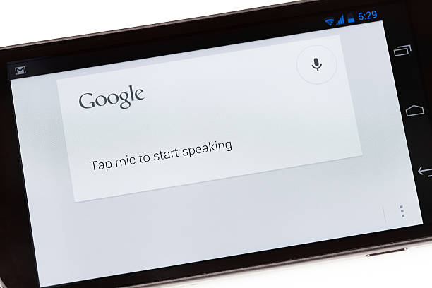 Florence, Italy - August 17, 2012: Close up of the Galaxy Nexus smartphone on white background showing the Google Voice Search application. Google Voice Search is a voice recognition system provided by Google which allows users to give voice commands to find information and control the phone.