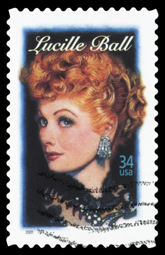 Sacramento, California, USA - March 20, 2011: A 1999 USA postage stamp with a photo of Lucy and Ricky Ricardo (played by Lucille Ball and Desi Arnaz), the main characters in the classic 1950s TV comedy series I Love Lucy. I Love Lucy is a registered trademark of CBS Broadcasting Inc.
