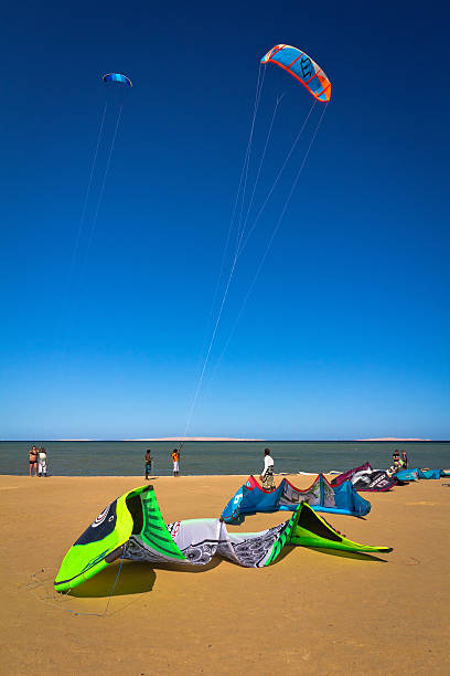 Kitesurfing in Egypt "Hurghada, Egypt - December 08, 2012: Recreational pursuit on the beach by the Red Sea in Hurghada, Egypt. Young tourists learn to operate kitesurfing under the supervision of instructors" kiteboarding stock pictures, royalty-free photos & images