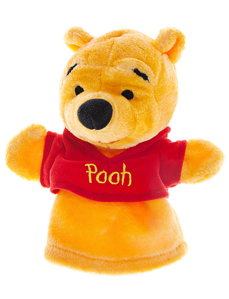 Winnie-the-Pooh Hand Puppet "Albuquerque, USA - November 10, 2012: Winnie-the-Pooh is a popular character from Winnie-the-Pooh childrens books. The stories, popular worldwide, were written by A. A. Milne and they feature adventures of a teddy bear called Winnie-the-Pooh and his friends Piglet, Eeyore, Owl, Tigger and,  Rabbit." winnie the pooh photos stock pictures, royalty-free photos & images