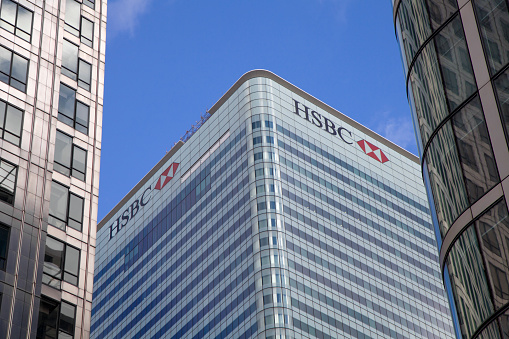 London, England - February 2, 2013: HSBC Headquaters in Canary Wharf, London. Daytime view from outside at ground level. 