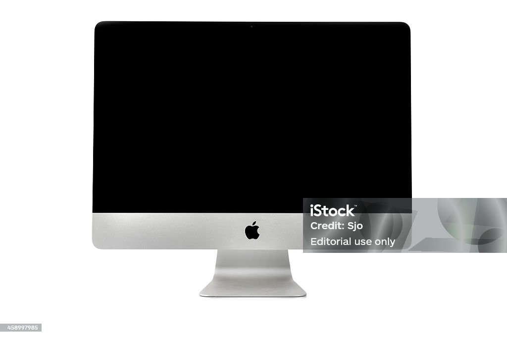 iMac desktop computer Kampen, The Netherlands - January 9, 2013: Apple iMac desktop computer isolated on a white background with a reflection in the foreground. The computer is turned off and the screen is blank. Equipment Stock Photo