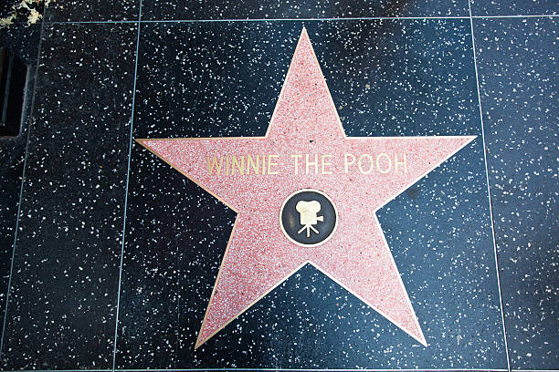 Hollywood Walk Of Fame Star Winnie The Pooh "Hollywood, CA, USA - August 2, 2011: Hollywood Walk Of Fame Winnie The Pooh achievement in the entertainment industry star." winnie the pooh photos stock pictures, royalty-free photos & images