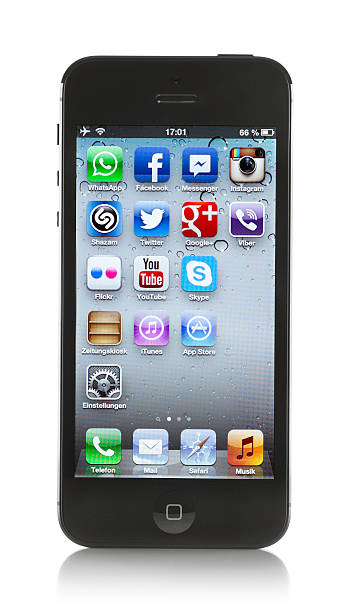 Black Apple iPhone 5 on white background "Hamburg, Germany - November 16, 2012: Produkt shot of the new Apple iPhone 5 isolated on white background displaying social network icons on the home page" animal retina stock pictures, royalty-free photos & images