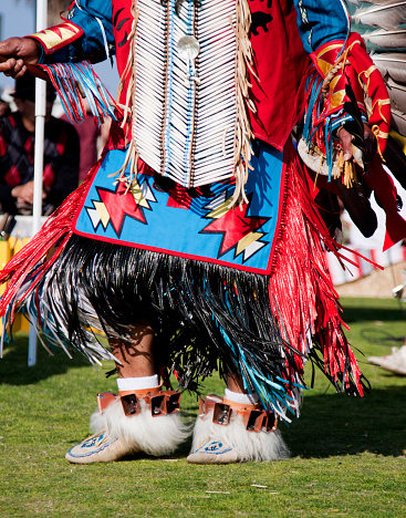 Imperial Beach, USA - June 16, 2012: Native American man in traditional beaded attire. Photograph taken at the annual Pow Wow by the Sea in Imperial Beach, California, USA.  The Pow Wow by the Sea is a free, public event held in a public park.