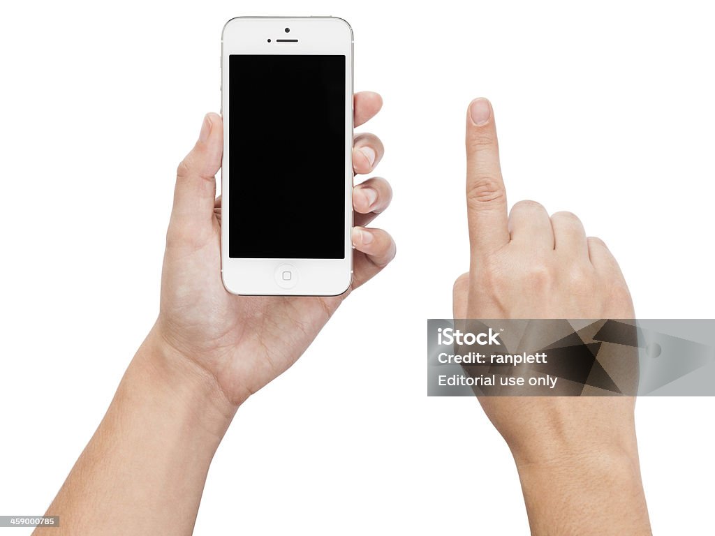 Mains tenant un iPhone 5 (isolé sur blanc) - Photo de Adulte libre de droits