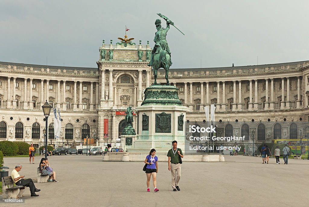 Statue of Archduke Charles "Vienna, Austria - July 5, 2012: Archduke Karl equestrian statue in the Heldenplatz in Vienna. The pattern created by Anton Dominik Fernkorn equestrian statue is considered technical achievement, as the horse's base with its hind legs and thus affect the twenty-ton metal statue stands on only two points. The square is the site of the Imperial Palace and outer castle was under Emperor Franz Joseph I designed as part of the Imperial Forum, which was never completed. At the Heroes Square are many parks which are often used by tourists and visitors for walking." Austria Stock Photo