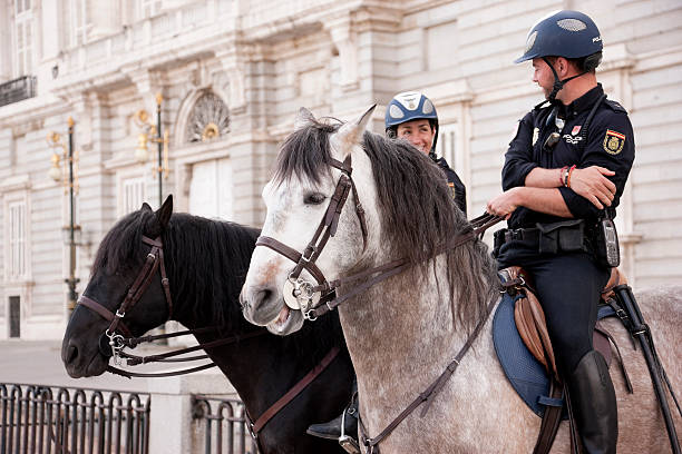Horse police in front of Royal Palace, Madrid stock photo