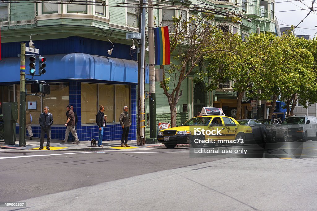 Castro, San Francisco "San Francisco, USA - May 27, 2011: Crossing of two streets in Castro the famous quarter in San Francisco during daytime. People  in the background and taxi pulling over" California Stock Photo