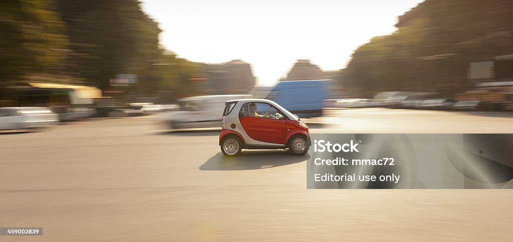 Car in the Streets of Milan, Italy "Milan,Italy - September 29, 2011: Panning photo of a Smart car speeding in the streets of Milan during daytime." Smart - Automobile Brand Stock Photo