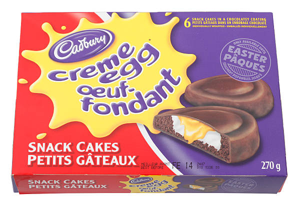 Box of Six Cadbury Cream Egg Snack Cakes Cantley, Canada - February 15, 2012: A 270g Box of Six Cadbury Cream Egg Snack Cakes. This product is a seasonal snack available until easter. cadbury plc photos stock pictures, royalty-free photos & images