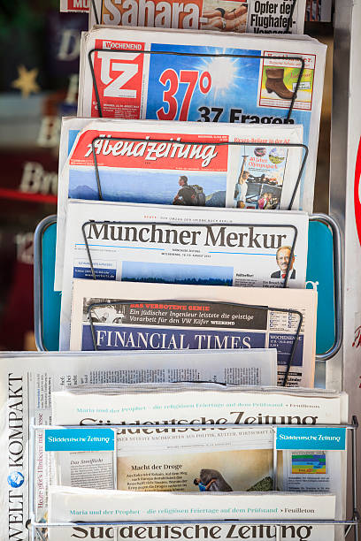 Newspapers of Munich, Germany Munich, Germany - August 18, 2012: Newspapers on a news rack in Munich, Germany. All the local and regional papers present. From top to bottom: süddeutsche zeitung photos stock pictures, royalty-free photos & images