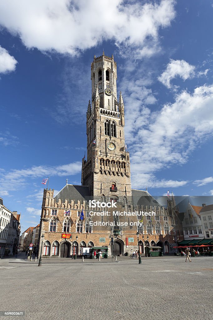 Belfry In Bruges, Belgium "Bruges, Belgium - June 8, 2011: The Belfry tower with some people in Bruges, Belgium in summer" Bruges Stock Photo