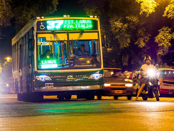 autobus e motocicli a un incrocio, buenos aires, argentina - public transportation buenos aires argentina palermo buenos aires foto e immagini stock