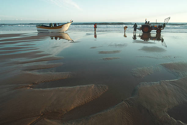 Fishermen on the Beach stock photo