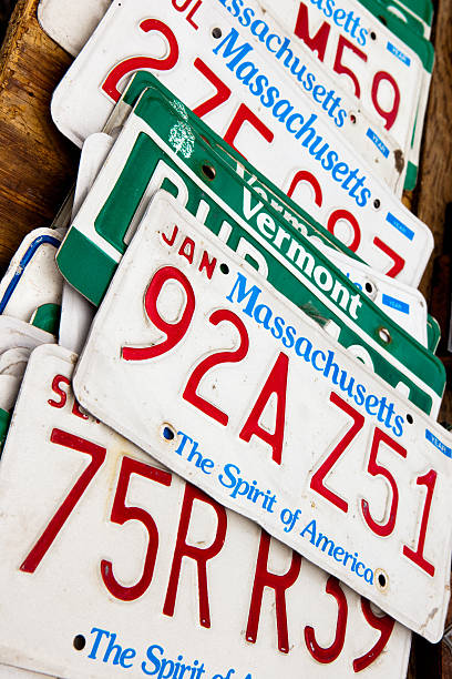 License Plates "New York, USA - June 17, 2012: American license plates of various states on the vintage shop at Hell's Kitchen Flea Market." new york state license plate stock pictures, royalty-free photos & images