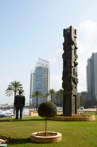Beirut, Lebanon - February 24, 2013: Captured from Rafik Hariri Memorial Garden, Marina on the left side and the luxury residences, high buildings on the right side. After the assassination of the ex-Prime Minister, Rafic Hariri, on February 14, 2005, a memorial space dedicated to his memory was built.He  was killed by a car bomb in Beirut on February 14, 2005. The statue stands close to the spot where he died, near the St. George Hotel.