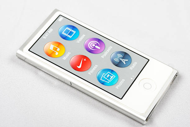 Ipod Nano "Mexico City, Mexico - January 15, 2013: Ipod Nano version 2013 with multitouch screen and bluetooth. The image shows a new device with the plastic screen protector on, over white background." ipod nano stock pictures, royalty-free photos & images