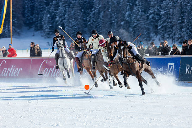 Polo Players Chase Ball stock photo