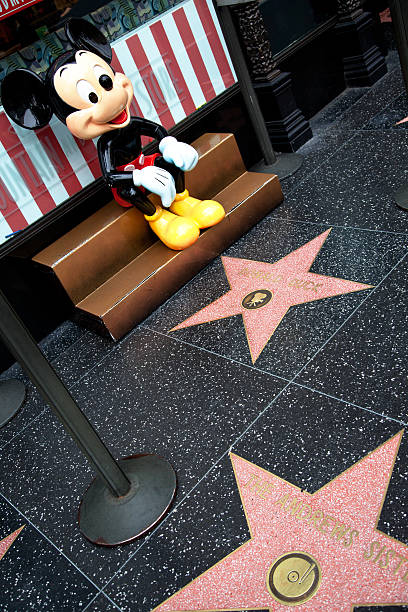 Hollywood Walk Of Fame Star Mickey Mouse "Hollywood, California, USA - February 5, 2013: Hollywood Walk Of Fame Mickey Mouse achievement in the entertainment industry star." winnie the pooh photos stock pictures, royalty-free photos & images
