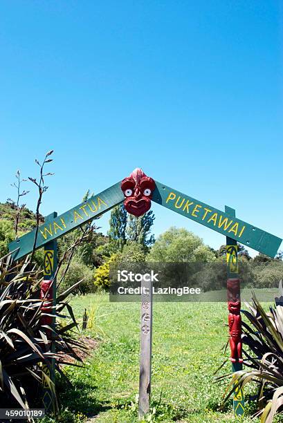 Wai Atua Puketawai Maori Gatepost Stock Photo - Download Image Now - Ancestral Guarding Post, Blue, Building Entrance