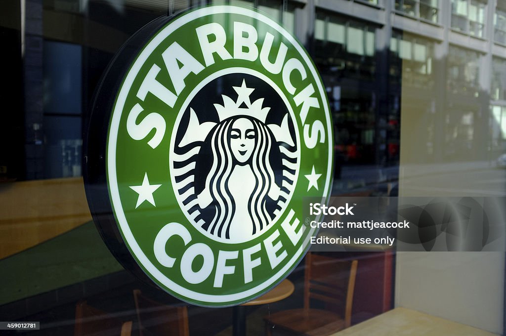 Starbucks Coffee sign "London, United Kingdom - February 25, 2012: Starbucks Coffee sign. Starbucks is an international, coffee company based in Seattle" Starbucks Stock Photo