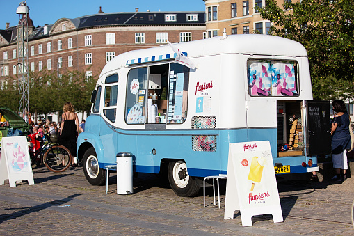 Copenhagen, Denmark - July 25, 2012: An old fashioned ice cream truck from Hansens is parked on Islands Brygge on a warm summer day at the harbor