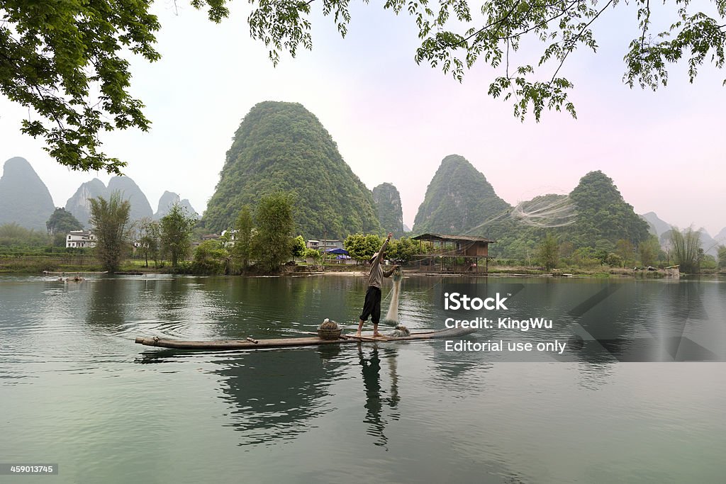 Pescatore in Cina - Foto stock royalty-free di Acqua