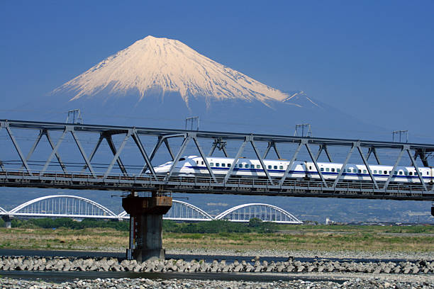 Shinkansen bullet train passing near the mountain Fuji stock photo