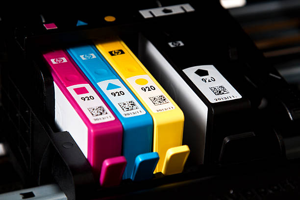 Hewlett Packard Ink Cartridges "Chula Vista, USA - March 15, 2012: Hewlett Packard Ink Cartridges for a HP Officejet printer.  Color and black ink cartridges are in the printer." cartridge stock pictures, royalty-free photos & images
