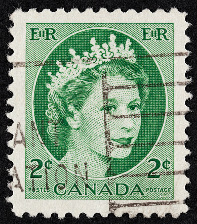 Belgrade, Serbia - December 09, 2011: Postage stamp. An English Used First Class Postage Stamp printed in CANADA showing Portrait of Queen Elizabeth in green