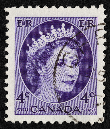 Belgrade, Serbia - December 09, 2011: Postage stamp. An English Used First Class Postage Stamp printed in CANADA showing Portrait of Queen Elizabeth in purple