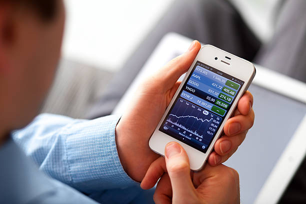 existências aplicação de - iphone trading stock market finance imagens e fotografias de stock